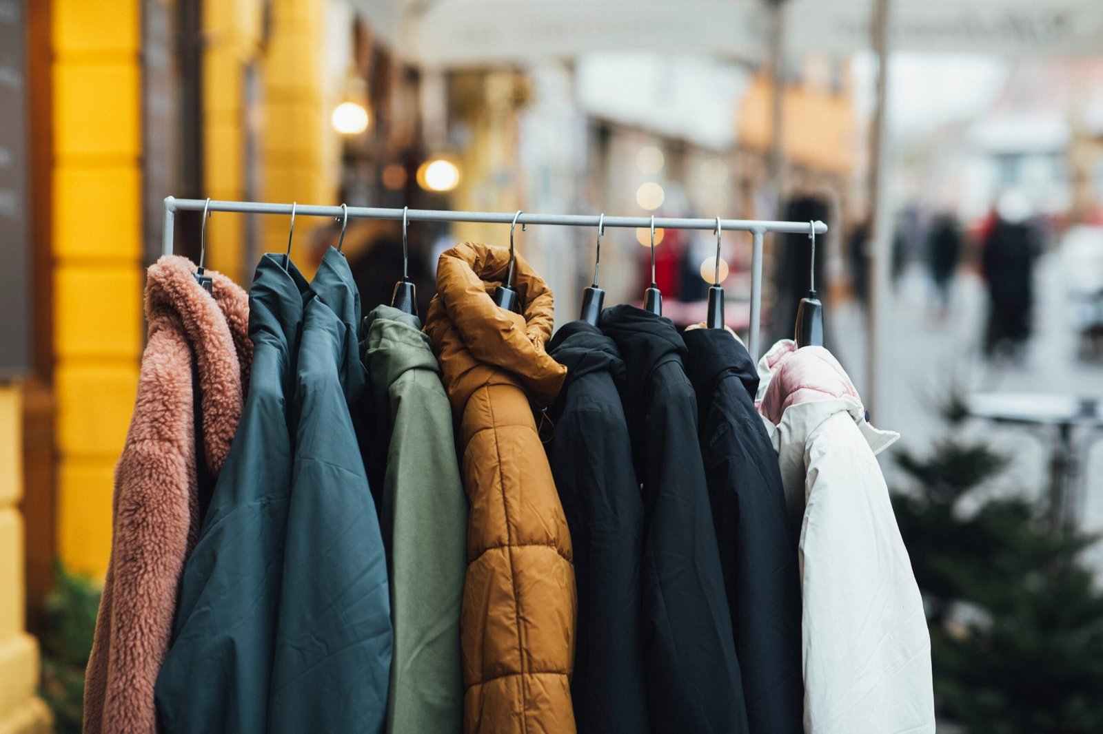 a rack of clothes hanging on a rail